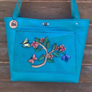 Teal Leather Tote Bag with a 3-d Hibiscus and Butterfly design hand painted and molded from leather